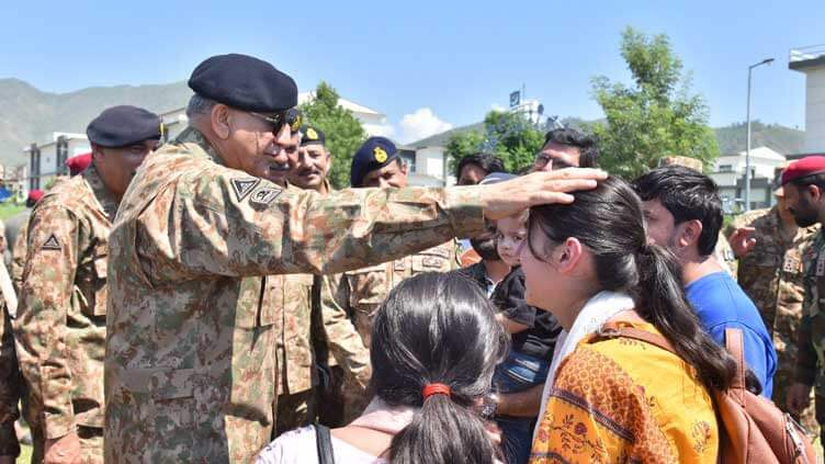 Army Chief with flood victims in swat
