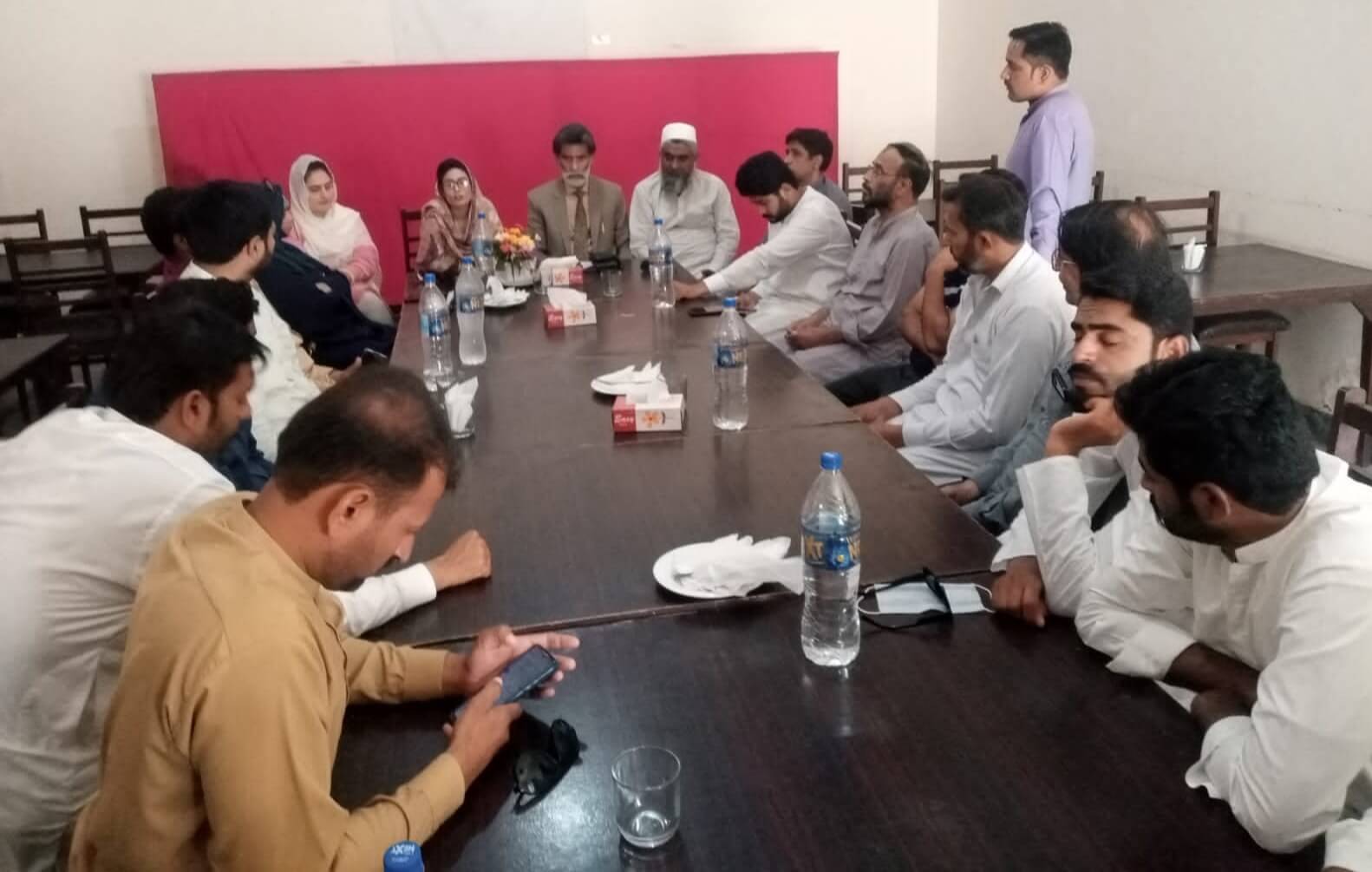 District Coordinator Now & Never Movement Syeda Isha Bukhari exchanges views with male and female political activists.