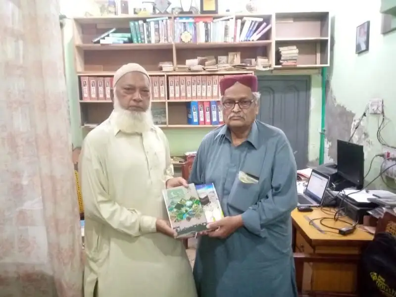 Editor Haqiqat Saeed Ahmed presenting his two titles to Editor Ehsan Ahmed Sehar