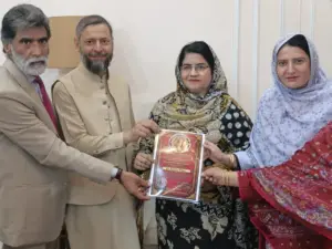 "Hafiz Muzzafar Karim Mughal Advocate distributes honorary degrees at International Human Rights Sardar Najeebullah Advocate's residence meeting."